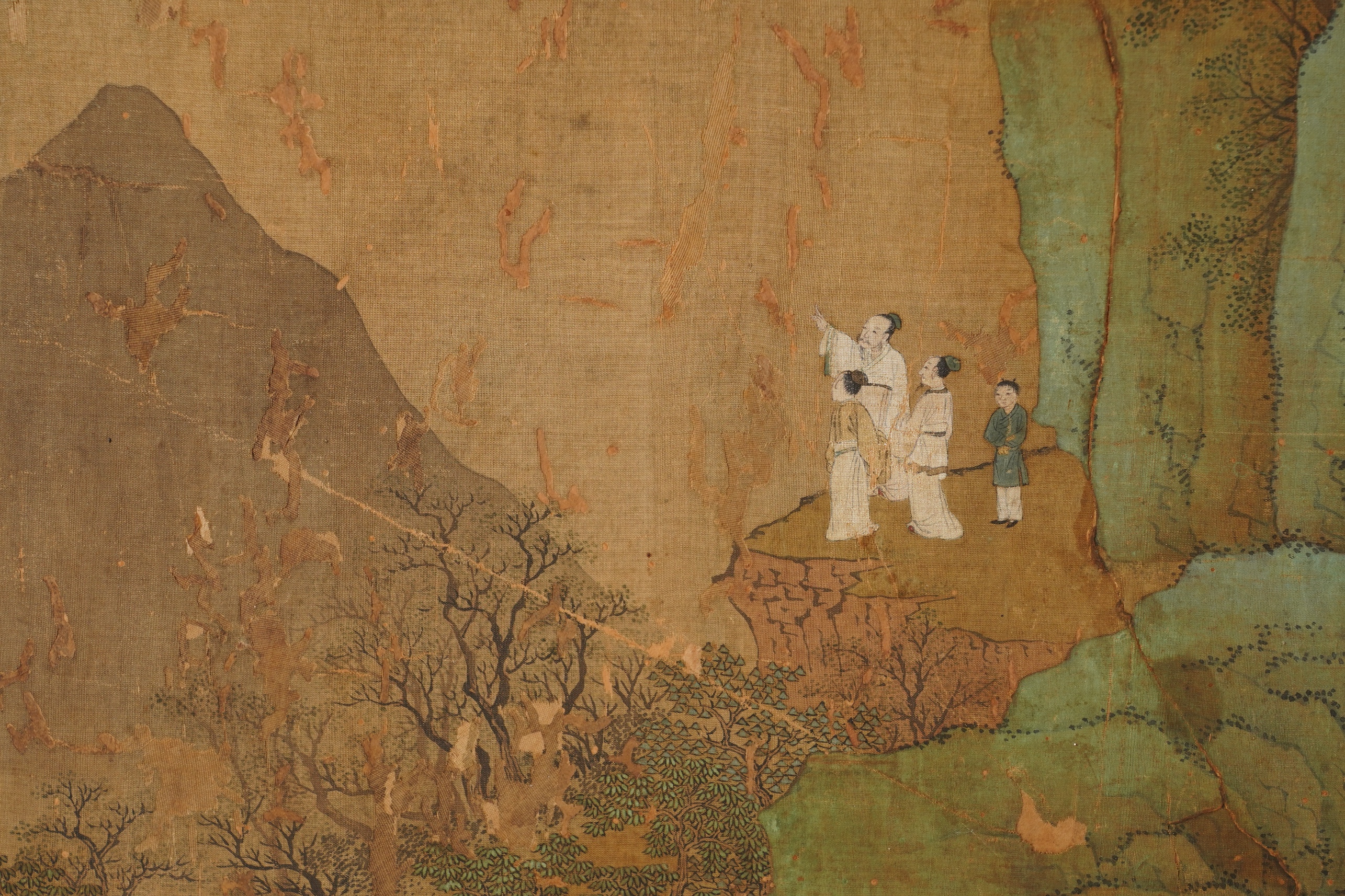 Chinese School , 17th century or earlier, Scholars in a mountainous river landscape scene with pavilions, Ink and colour on silk, incomplete clerical script signature, 54cm x 290cm
